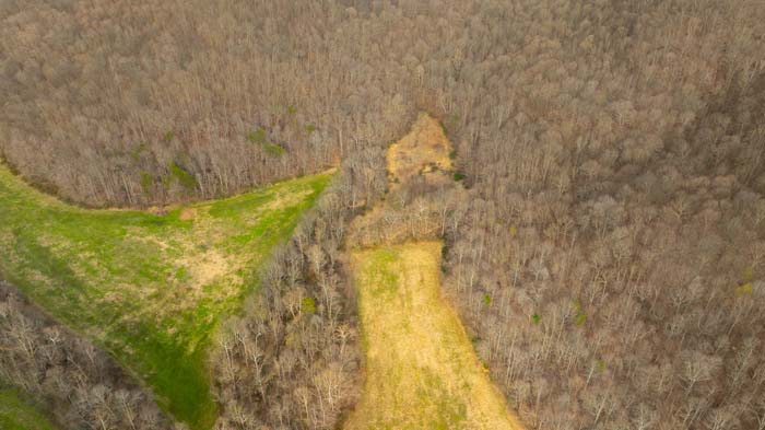 Aerial view showing wooded landscape and ridges