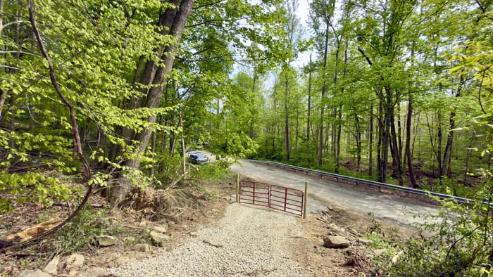 New gravel driveway and gated entrance