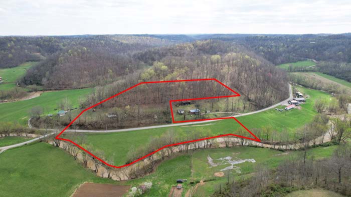 Creek frontage with wooded views