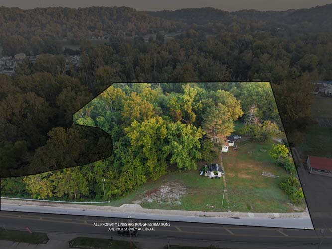 Property with small home and two car garage