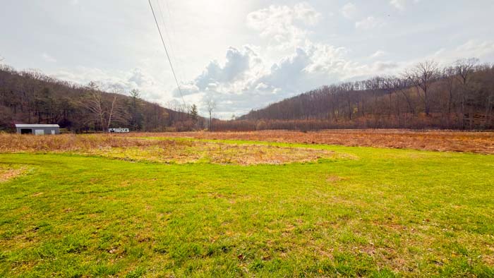 Southern Ohio land for sale with rolling terrain and wooded landscape