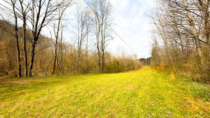 Ohio land for sale featuring wooded hills and open terrain