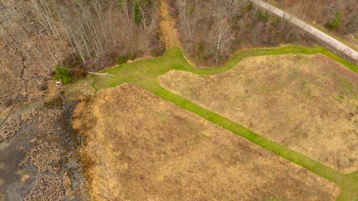 Country land with forest cover and open recreational space