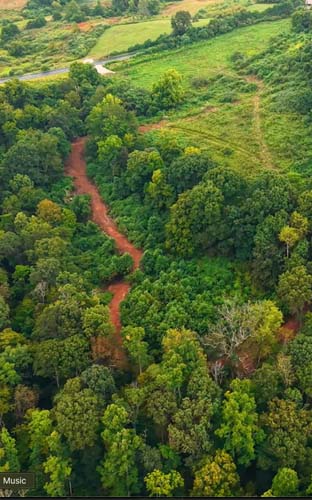 Grassy rise with long-range views of countryside