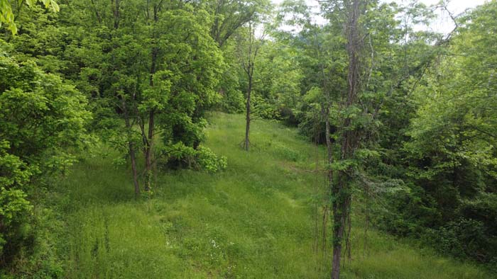 natural funnel formed by ridge and valley structure