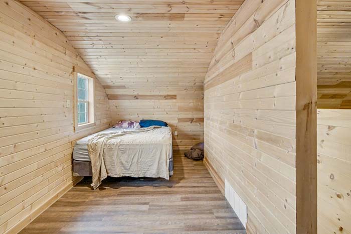 Open area beside creek ideal for camp or equipment staging on Rife Road