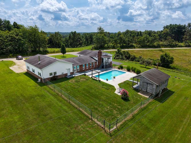 In-ground pool with surrounding patio space