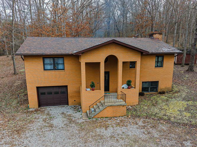 588 Ward Road Bidwell Ohio home for sale on wooded acreage with private rural setting