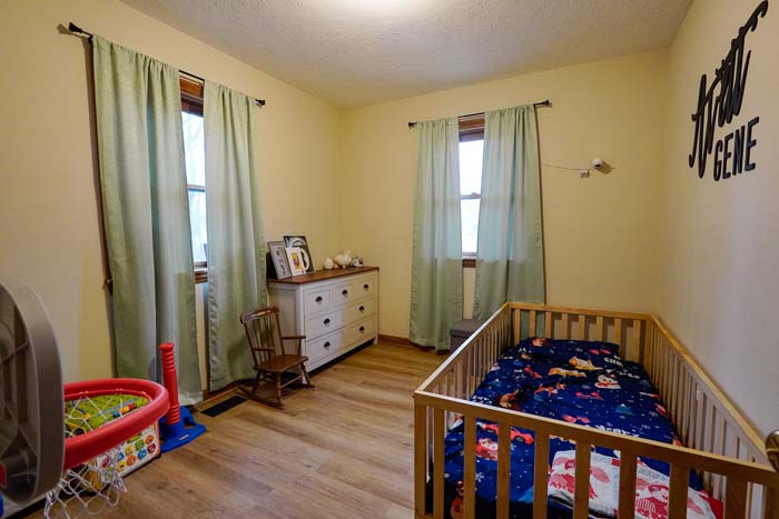 Exterior rear view of home and wooded acreage at 588 Ward Road