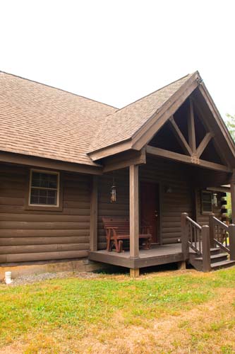 Open-concept cabin living space with wood accents