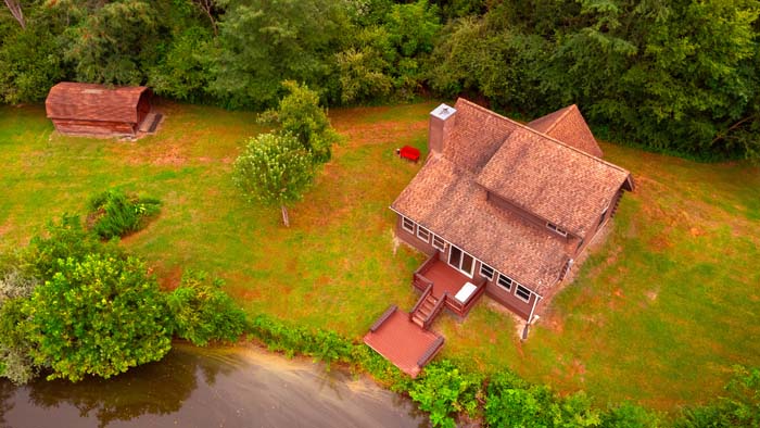 Backyard view of pond and cabin setting in Ohio