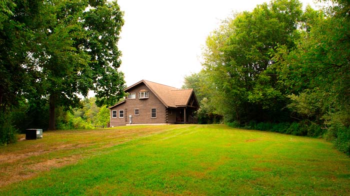 Private cabin setting with open yard and trees