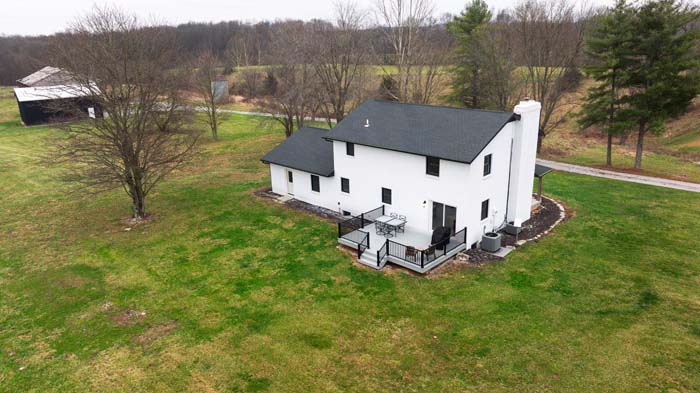 Winchester Ohio covered front porch overlooking stocked pond and pasture
