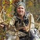 Jason Williams posing with a buck