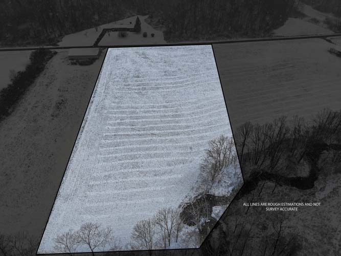 Scenic building site on Venisonham Camp Branch Road with snow covered fields in Lawrence County Ohio